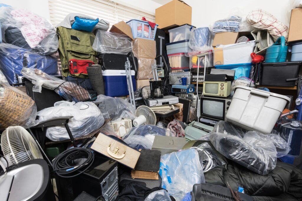 hoarder home with boxes of items all stacked up in the way